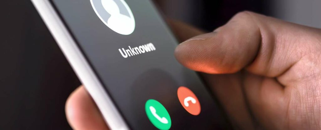 unknown caller on an iphone symbolizes a potential medicare card scam