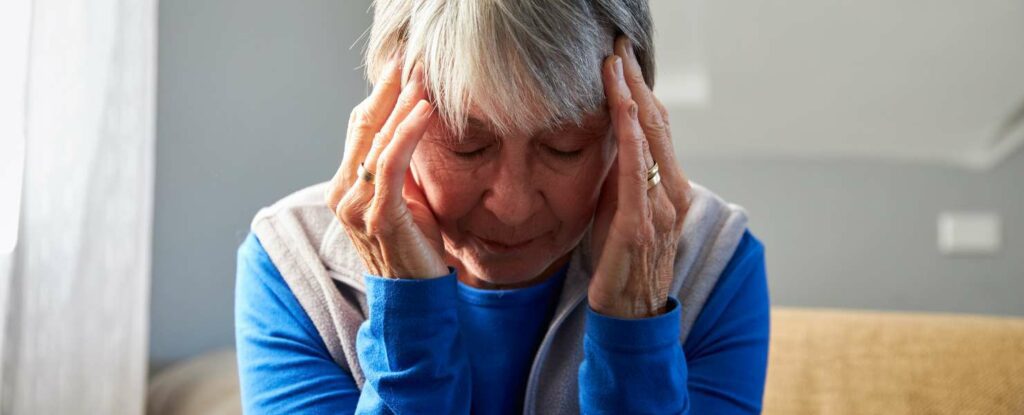 woman with a headache that could be a stroke symptom